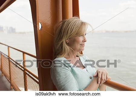 Mature woman on passenger ferry View Large Photo Image Stock Image - Mature woman on passenger ferry. Fotosearch