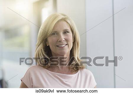 Mature woman with blonde hair, portrait View Large Photo Image Stock Image - Mature woman with blonde hair, portrait. Fotosearch