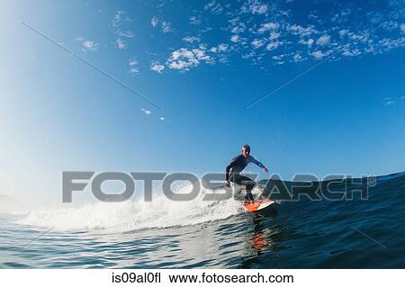 Mid adult man surfing wave, Leucadia, California, USA View Large Photo Image Stock Image - Mid adult man surfing wave, Leucadia, California, USA. Fotosearch
