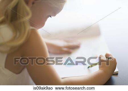 Over shoulder view of girl coloring in book with crayons View Large Photo Image Picture - Over shoulder view of girl coloring in book with crayons. Fotosearch