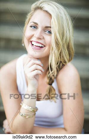 Portrait of a happy young woman View Large Photo Image Stock Image - Portrait of a happy young woman. Fotosearch