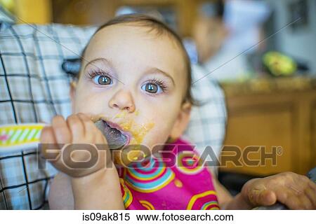 baby eating from spoon