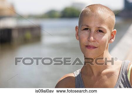 Portrait of calm young female cancer survivor View Large Photo Image Stock Photo - Portrait of calm young female cancer survivor. Fotosearch