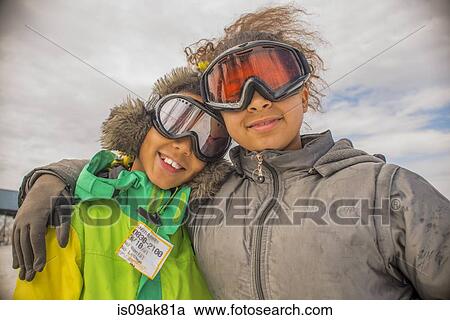 Portrait of children in ski goggles View Large Photo Image Stock Image - Portrait of children in ski goggles. Fotosearch