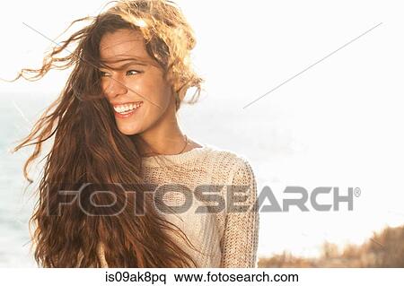 Portrait of young woman at coast, Malibu, California, USA View Large Photo Image Stock Photography - Portrait of young woman at coast, Malibu, California, USA. Fotosearch