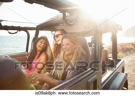 Three young women driving in jeep at coast, Malibu, California, USA View Large Photo Image Stock Image - Three young women driving in jeep at coast, Malibu, California, USA. Fotosearch