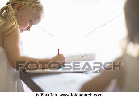 Two sisters coloring in books with crayons View Large Photo Image Stock Photograph - Two sisters coloring in books with crayons. Fotosearch