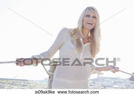 Woman doing yoga with ropes View Large Photo Image Stock Image - Woman doing yoga with ropes. Fotosearch