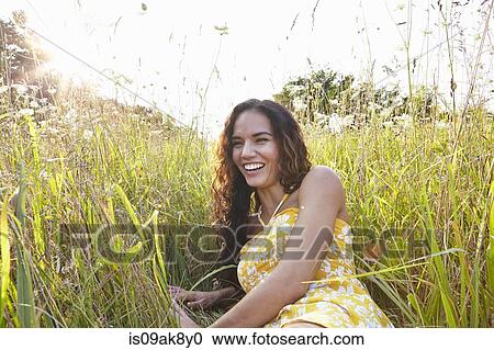 Woman in field of wildflowers View Large Photo Image Stock Image - Woman in field of wildflowers. Fotosearch