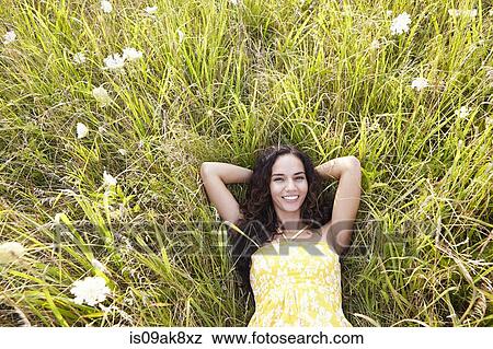 Woman in field of wildflowers View Large Photo Image Stock Photo - Woman in field of wildflowers. Fotosearch