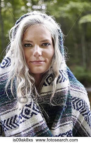 Woman with blanket around her View Large Photo Image Stock Photograph - Woman with blanket around her. Fotosearch
