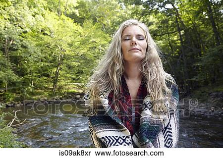 Woman with blanket around her View Large Photo Image Stock Photography - Woman with blanket around her. Fotosearch