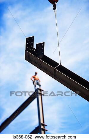 Beam and construction worker View Large Photo Image Stock Image - Beam and construction worker. Fotosearch