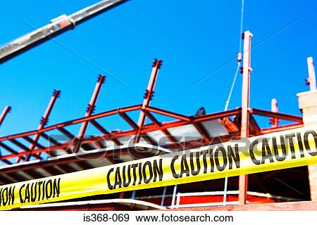 Caution tape at construction site View Large Photo Image Stock Photo - Caution tape at construction site. Fotosearch