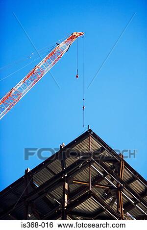 Stock Photograph - Crane and building under construction. Fotosearch