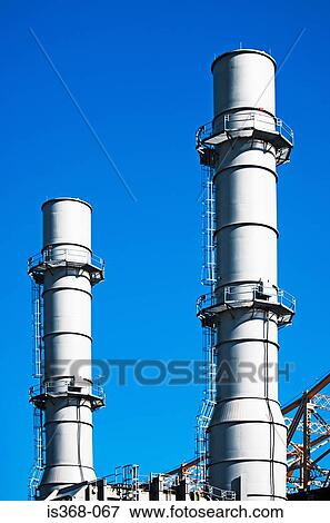 Industrial chimneys View Large Photo Image Stock Photo - Industrial chimneys. Fotosearch