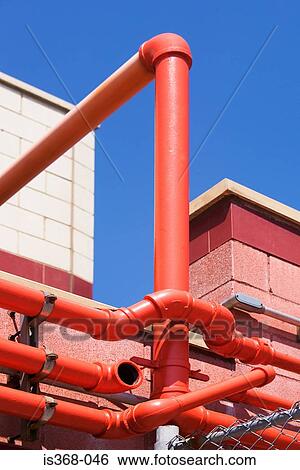 Pipes on a building View Large Photo Image Stock Photograph - Pipes on a building. Fotosearch