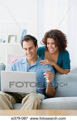 Couple online shopping View Large Photo Image Stock Photo - Couple online shopping. Fotosearch