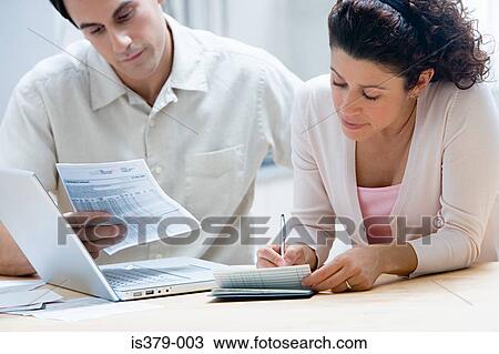 Couple sorting out home finances View Large Photo Image Stock Image - Couple sorting out home finances. Fotosearch