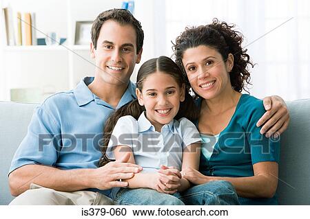 Family sitting on a sofa View Large Photo Image Stock Image - Family sitting on a sofa. Fotosearch