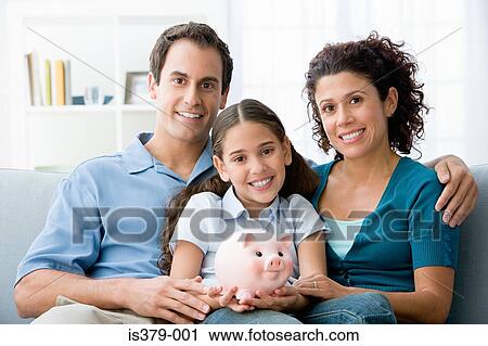 Stock Image - Family with a piggy bank. Fotosearch