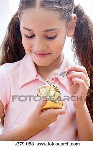 Girl holding a coin and purse View Large Photo Image Stock Image - Girl holding a coin and purse. Fotosearch