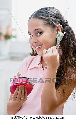 Girl holding a purse and bank note View Large Photo Image Stock Photography - Girl holding a purse and bank note. Fotosearch