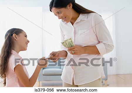 Stock Photograph - Mother giving daughter pocket money. Fotosearch