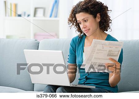 Woman paying bills online View Large Photo Image Stock Photograph - Woman paying bills online. Fotosearch