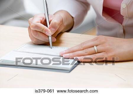 Woman writing a cheque View Large Photo Image Stock Image - Woman writing a cheque. Fotosearch