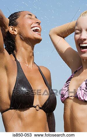 Woman getting sprayed with water View Large Photo Image Stock Image - Woman getting sprayed with water. Fotosearch