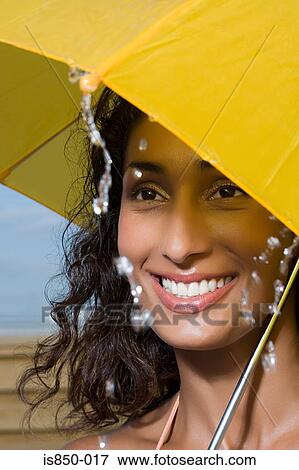 Woman holding umbrella View Large Photo Image Stock Photo - Woman holding umbrella. Fotosearch