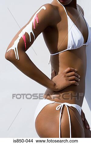 Woman with sun cream on her arm View Large Photo Image Picture - Woman with sun cream on her arm. Fotosearch