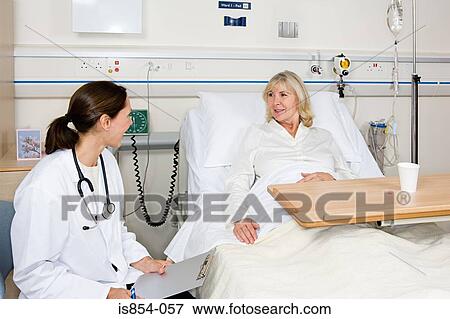 Doctor and patient in hospital View Large Photo Image Stock Photo - Doctor and patient in hospital. Fotosearch