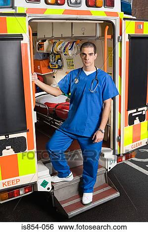 Doctor on steps of ambulance View Large Photo Image Stock Photograph - Doctor on steps of ambulance. Fotosearch