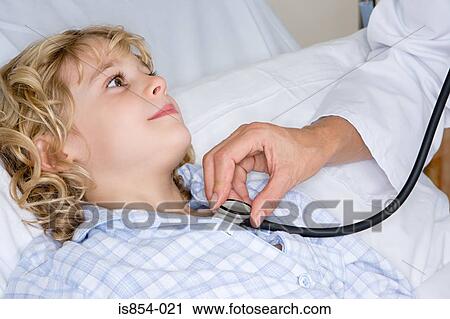 Stock Image - Girl and doctor with stethoscope. Fotosearch
