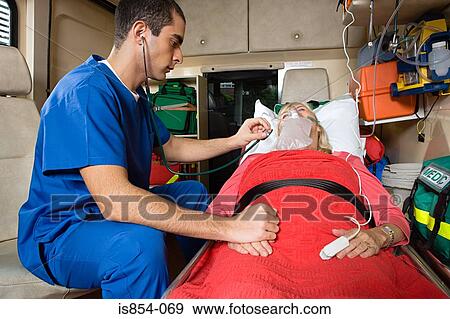 Nurse and patient in ambulance View Large Photo Image Stock Photo - Nurse and patient in ambulance. Fotosearch