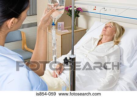 Nurse and sleeping patient View Large Photo Image Stock Photo - Nurse and sleeping patient. Fotosearch
