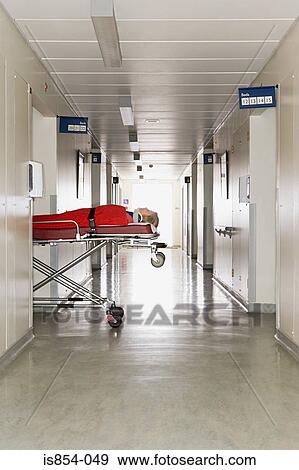 Stock Photo - Patient in a hospital corridor. Fotosearch