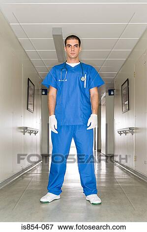 Surgeon in a hospital corridor View Large Photo Image Stock Photo - Surgeon in a hospital corridor. Fotosearch