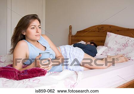 A woman holding a cup View Large Photo Image Stock Image - A woman holding a cup. Fotosearch