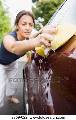 Woman cleaning car View Large Photo Image Stock Image - Woman cleaning car. Fotosearch