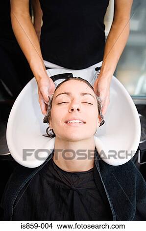Woman having hair washed View Large Photo Image Picture - Woman having hair washed. Fotosearch