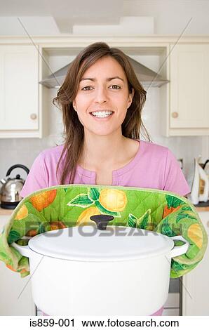 Woman holding casserole dish View Large Photo Image Stock Image - Woman holding casserole dish. Fotosearch