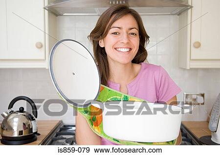 Woman holding casserole dish View Large Photo Image Stock Photo - Woman holding casserole dish. Fotosearch