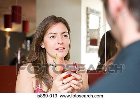 Woman holding cocktail View Large Photo Image Stock Photo - Woman holding cocktail. Fotosearch
