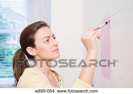 Woman painting wall View Large Photo Image Picture - Woman painting wall. Fotosearch