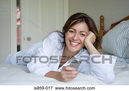 Woman using cell phone View Large Photo Image Stock Photo - Woman using cell phone. Fotosearch