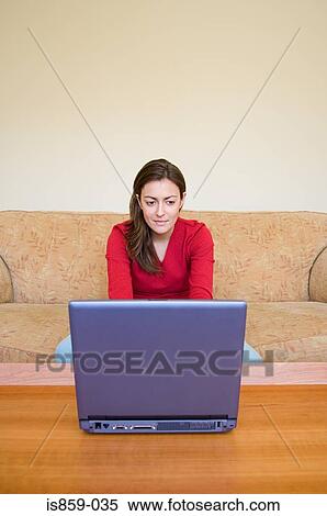 Woman using laptop View Large Photo Image Stock Photography - Woman using laptop. Fotosearch