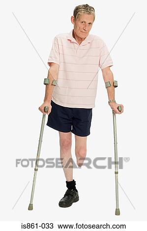 Male amputee using crutches View Large Photo Image Stock Image - Male amputee using crutches. Fotosearch